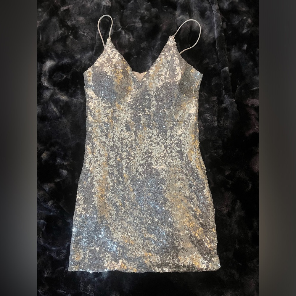 Silver sequin spaghetti strap mini dress.